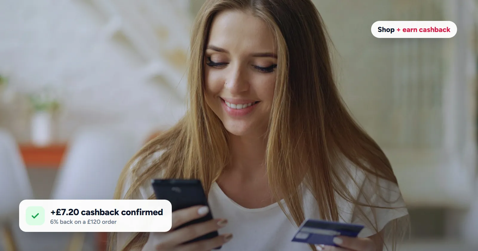 Woman shopping online with her phone and card, with a cashback confirmation for a £120 order